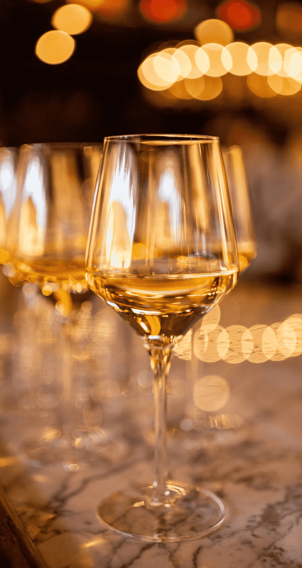Enjoy a glass of wine at Happy Hour at 90th Meridian